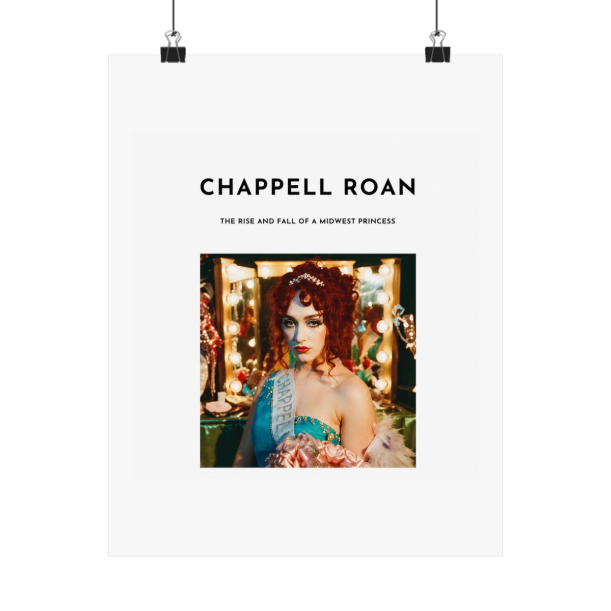 A Dresses with a white background and black text that reads "Chappell Roan, The Rise and Fall of a Midwest Princess". The Dresses features a photo of a woman with red hair wearing a blue and white... - alternate angle 5, merchandise