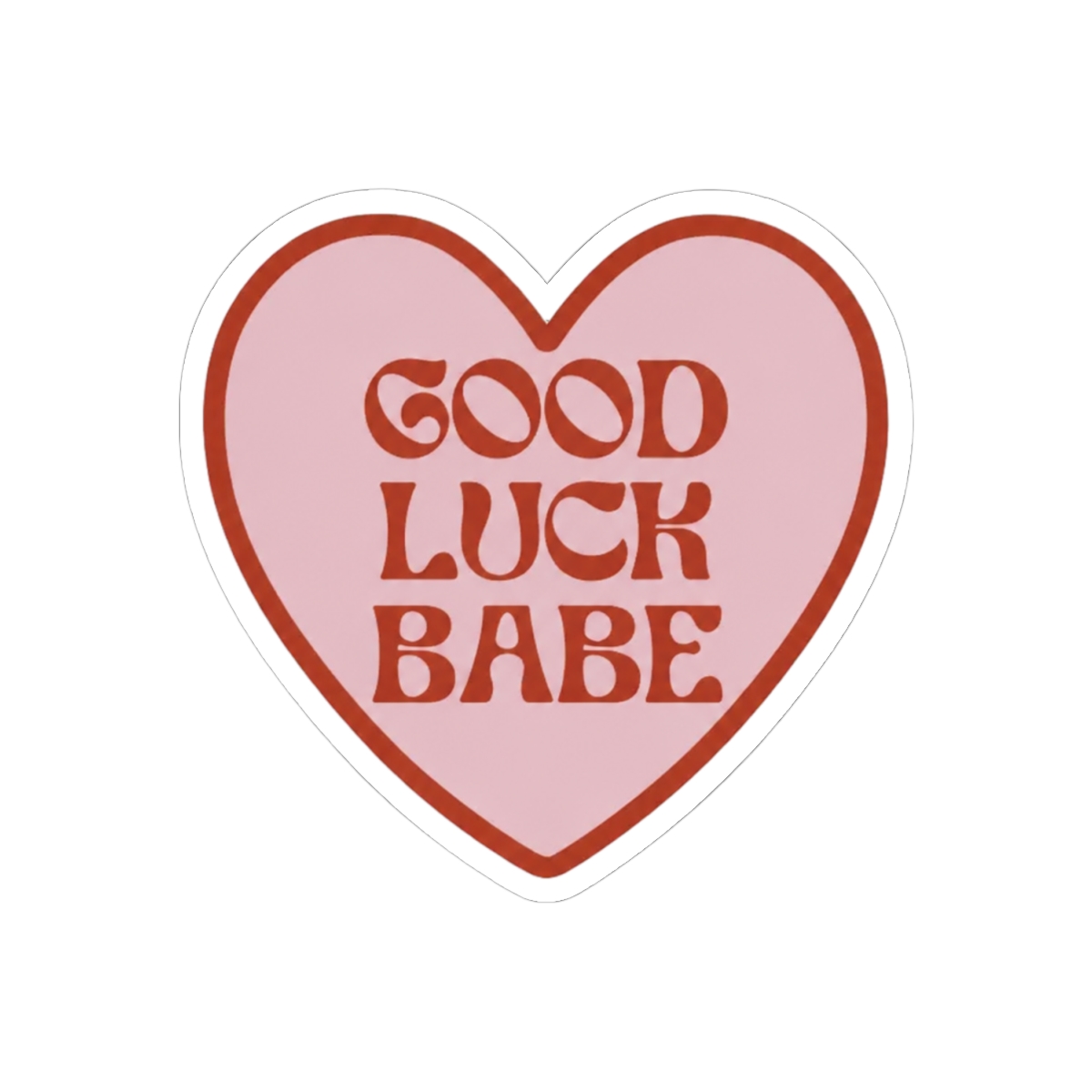 A heart-shaped sticker with a pink interior and a dark red border. The sticker features the words "GOOD LUCK BABE" in dark red, retro-style lettering. The sticker is held between two fingers against a... - alternate angle 1, merchandise